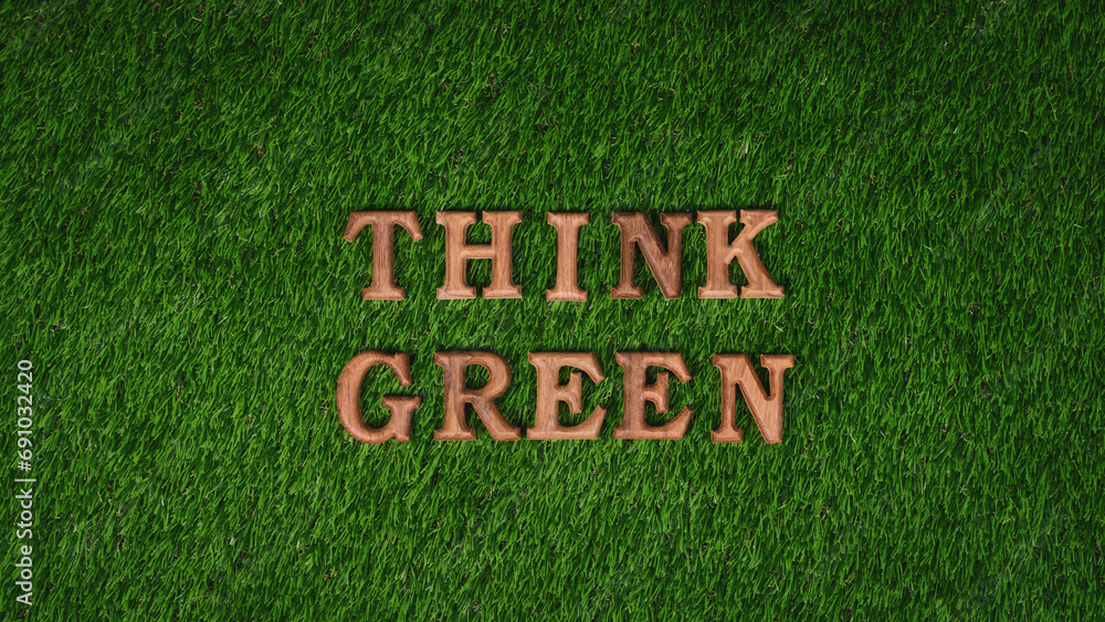 Wooden alphabet arranged in ECO awareness campaign design on biophilia green grass background to promote environmental protection for greener and sustainable future. Gyre