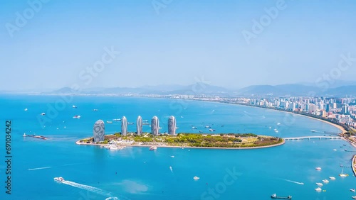 Time lapse photography of urban scenery surrounding Phoenix Island in Sanya, Hainan, China photo