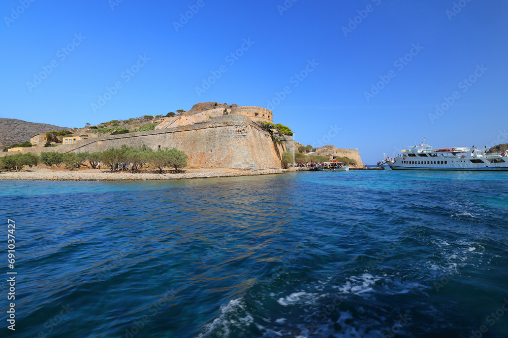 Spinalonga Island on a Beautiful sunny day blue sea and blue sky. Crete, Greece, Europe. Spinalonga Island on a Beautiful sunny day blue sea and blue sky. Crete, Greece, Europe.