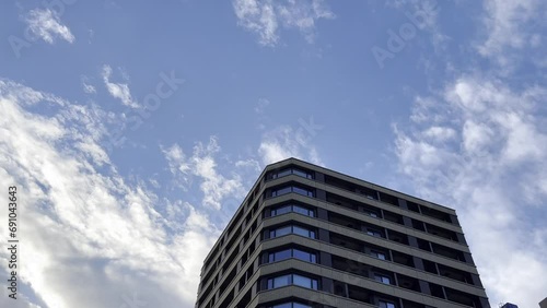 High angle view top of the building with moving cloud in the blue sky