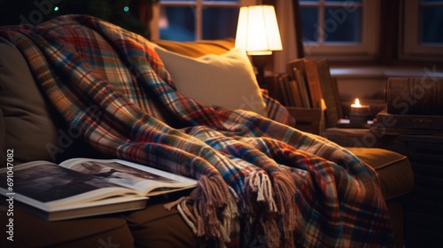 a picture of a cozy, plaid-patterned throw blanket draped over a couch