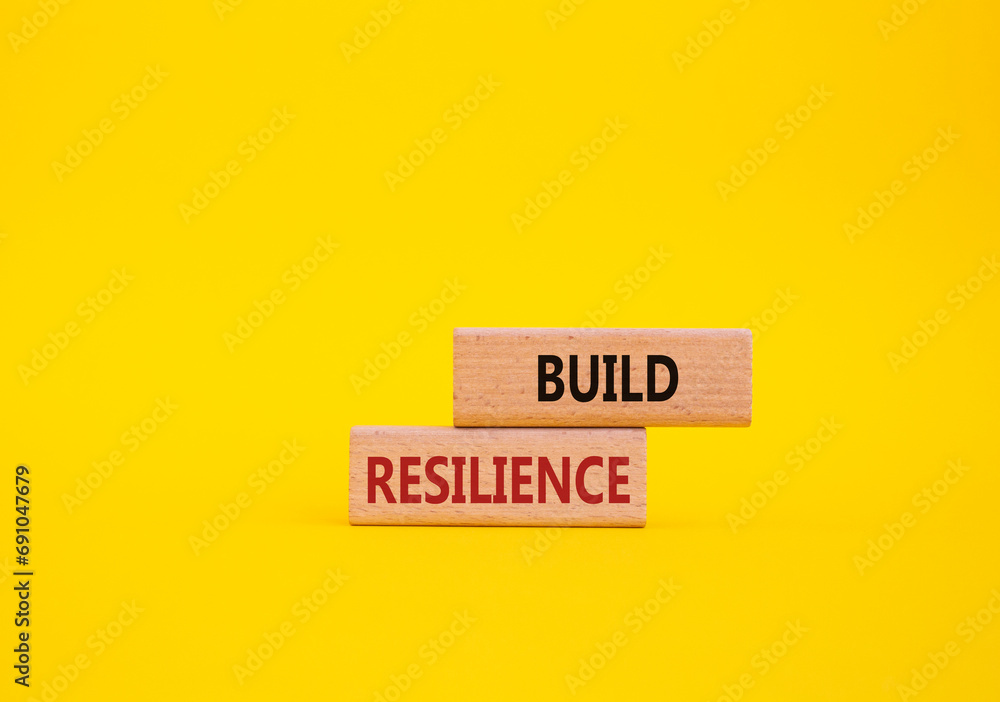 Build resilience symbol. Wooden blocks with words Build resilience. Beautiful yellow background. Business and Build resilience concept. Copy space. Build resilience symbol. Wooden blocks with words Build resilience. Beautiful yellow background. Business and Build resilience concept. Copy space.