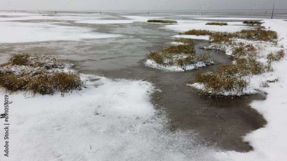 Winter am Strand mit Schnee und Eis, Wattenmeer, Nordsee Winter am Strand mit Schnee und Eis, Wattenmeer, Nordsee