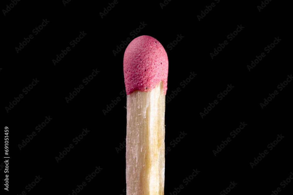 Wooden match with pink sulfur head closeup Wooden match with pink sulfur head closeup