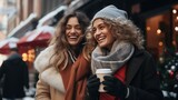 Two women enjoying a winter walk in the city, bundled up in stylish coats and sipping hot cocoa from festive cups
