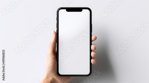 Phone with blank screen in hand. photo
