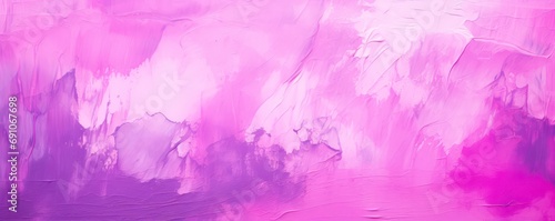Purple paint strokes and smudges on an pink painted wall background.  photo