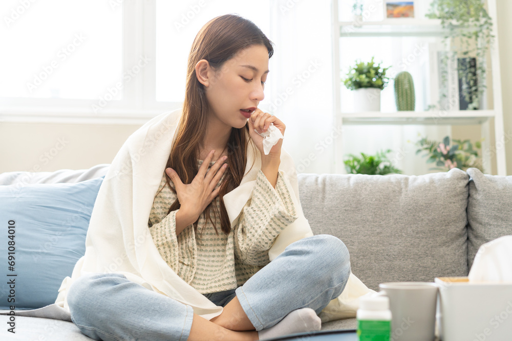 Sick, coronavirus or covid-19, illness asian young woman, girl with blanket have a fever, flu or sore throat and sneezing until chest pain while rest at home. Health care with disease, pandemic virus. Sick, coronavirus or covid-19, illness asian young woman, girl with blanket have a fever, flu or sore throat and sneezing until chest pain while rest at home. Health care with disease, pandemic virus.
