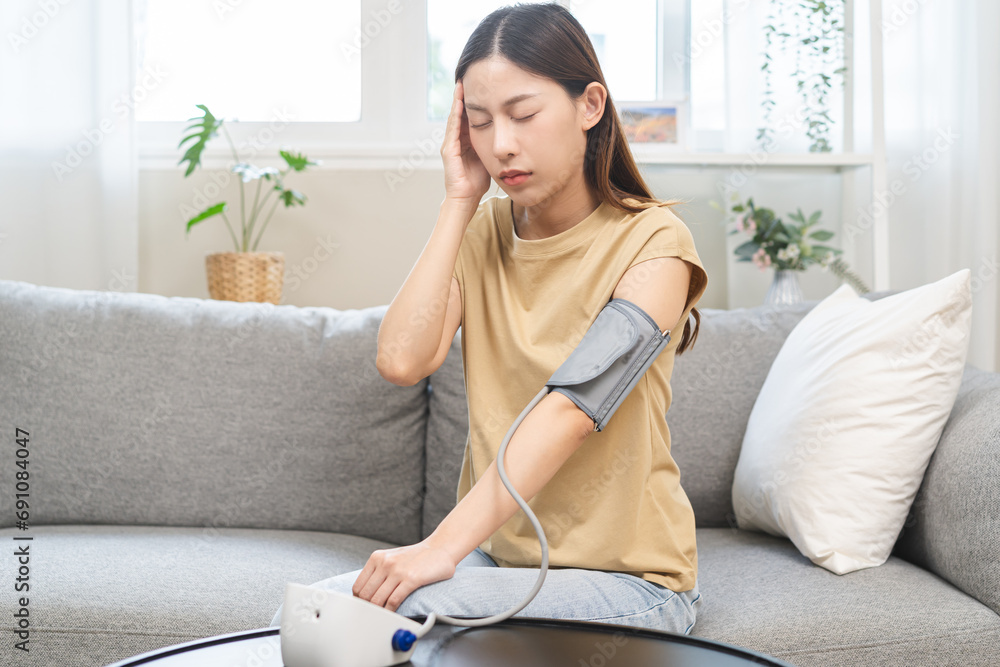 Hypotension problem, sick asian young woman dizzy, faint sitting on