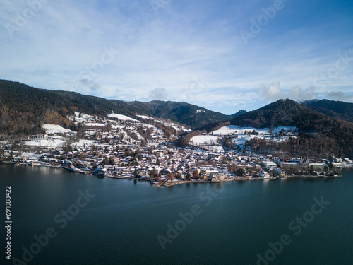 Aerial view of Tegernsee city as seen from above Tegernsee in winter with snow at a sunny day
