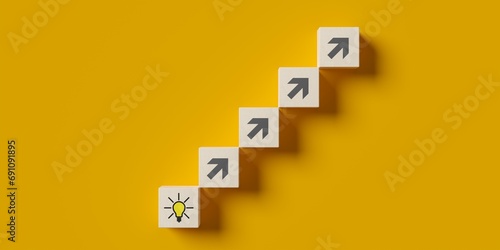Steps from wood blocks with arrows leading to light bulb symbol on blue background flat lay from above, idea or innovation or solution business concept photo