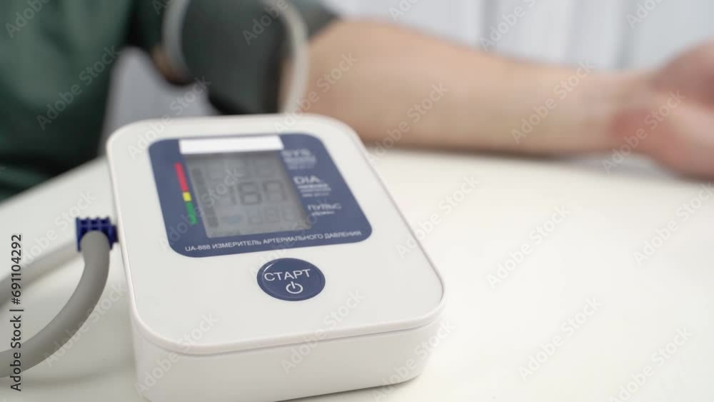the girl measures blood pressure with a tonometer the girl measures blood pressure with a tonometer