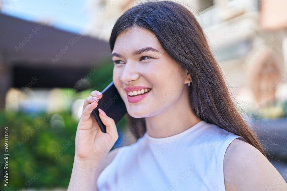 Young caucasian woman smiling confident talking on the smartphone at street Young caucasian woman smiling confident talking on the smartphone at street
