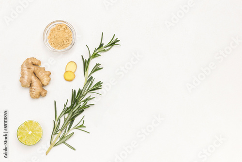 Ginger, rosemary sprig and lime. Alternative cold and flu remedy. photo