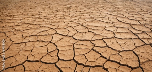  a picture of a desert that looks like it has cracked and has a lot of dirt on top of it.