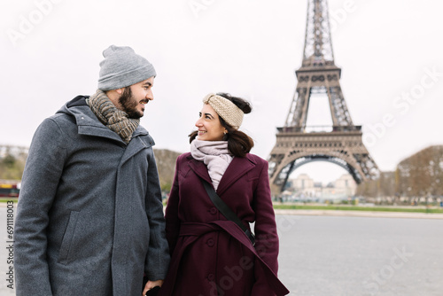 Photography Lovely young european couple walking through paris