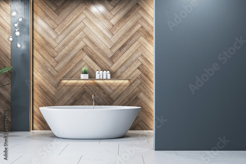 Elegant bathroom with freestanding bathtub against herringbone wood wall. Interior design concept. 3D Rendering photo