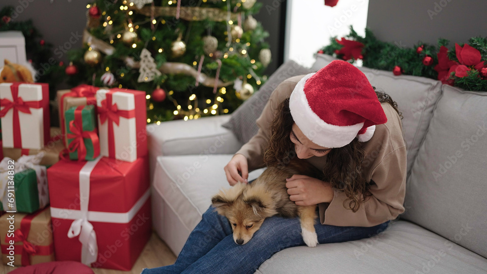 Young hispanic woman with dog smiling confident celebrating christmas at home Young hispanic woman with dog smiling confident celebrating christmas at home