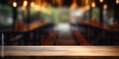 empty wooden wooden table in front of the black walls restaurant