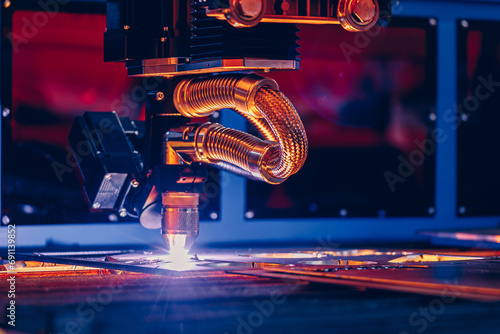 Metallurgy milling plasma cutting of metal CNC Laser engraving. Concept background modern industrial technology, blue toning photo