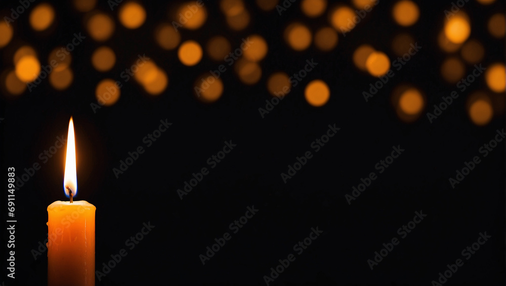 candle on dark black background with bokeh candle on dark black background with bokeh