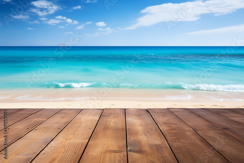 Empty wooden table with beach and turquoise water in blurry background