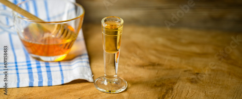 homemade mead (honey wine) on an old table close up photo