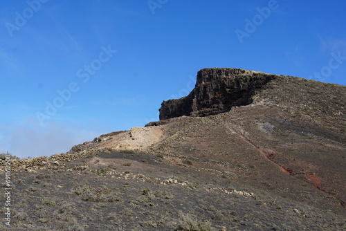 La Graciosa, view from top of the cliff, mirador la caldera, Lanzarote, trekking Haria, Maguez, November 2023, rock formations, volcanic formations, cliff, famara cliff