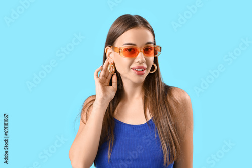 Stylish young woman in sung...