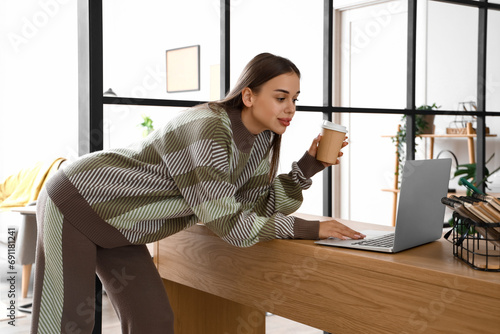Young woman with cup of cof...
