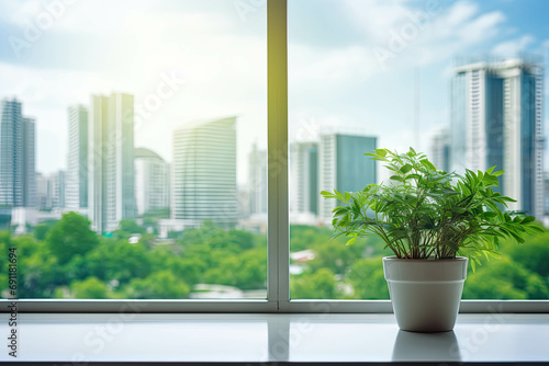 Eco green city view through window with a potted plant on a shelf