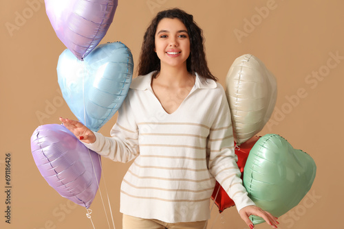 Happy young woman with hear...