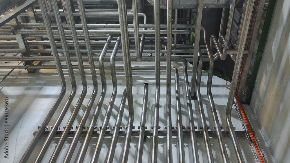 Stainless steel pipe, gauge and valve in production room of factory Stainless steel pipe, gauge and valve in production room of factory