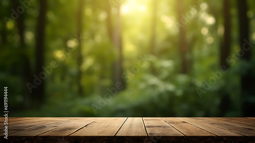 Empty wooden table with forest in blurry bokeh background