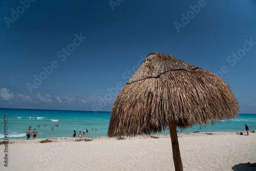 Straw Umbrella on Beach on Coast in Mexico