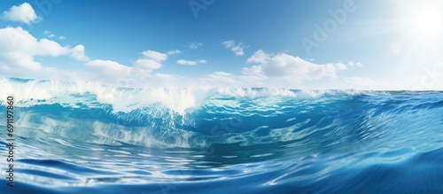 A scenic view of ocean waves under a blue sky on a sunny day. Copy space image. Place for adding text © Ilgun