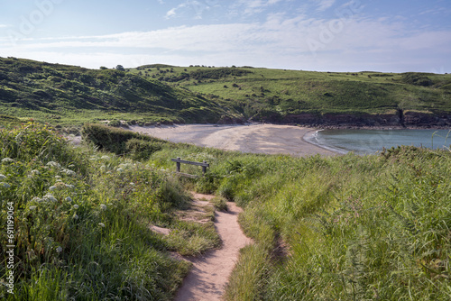 Cliff walk down to Manorbier Beach in South Wales photo