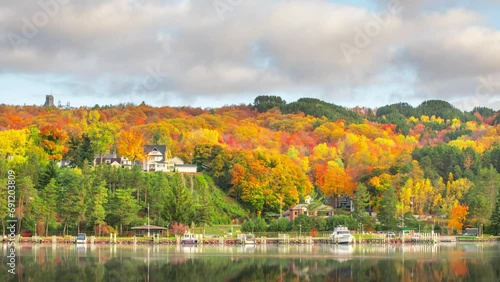 Time Lapse - Beautiful Autumn Landscape with reflection in the Portage Lake in Houghton, Upper Superior, Michigan photo