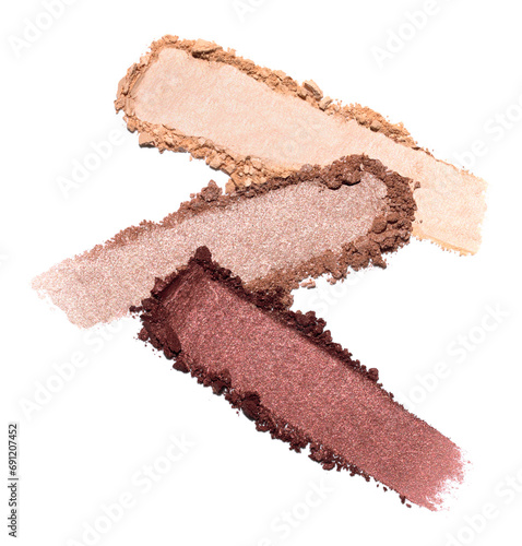 Red beige and bronze eye shadow texture swipe isolated on white background. Cosmetic product brush swatch photo