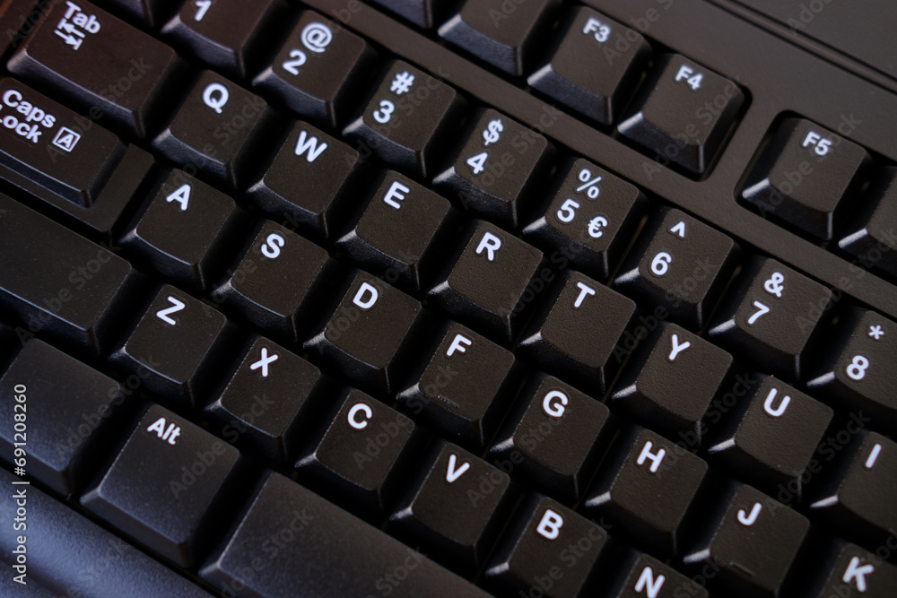 close-up black keyboard, office environment, computer peripherals, computer technologies and the IT industry, online learning, digital work routine, blogging and social media close-up black keyboard, office environment, computer peripherals, computer technologies and the IT industry, online learning, digital work routine, blogging and social media