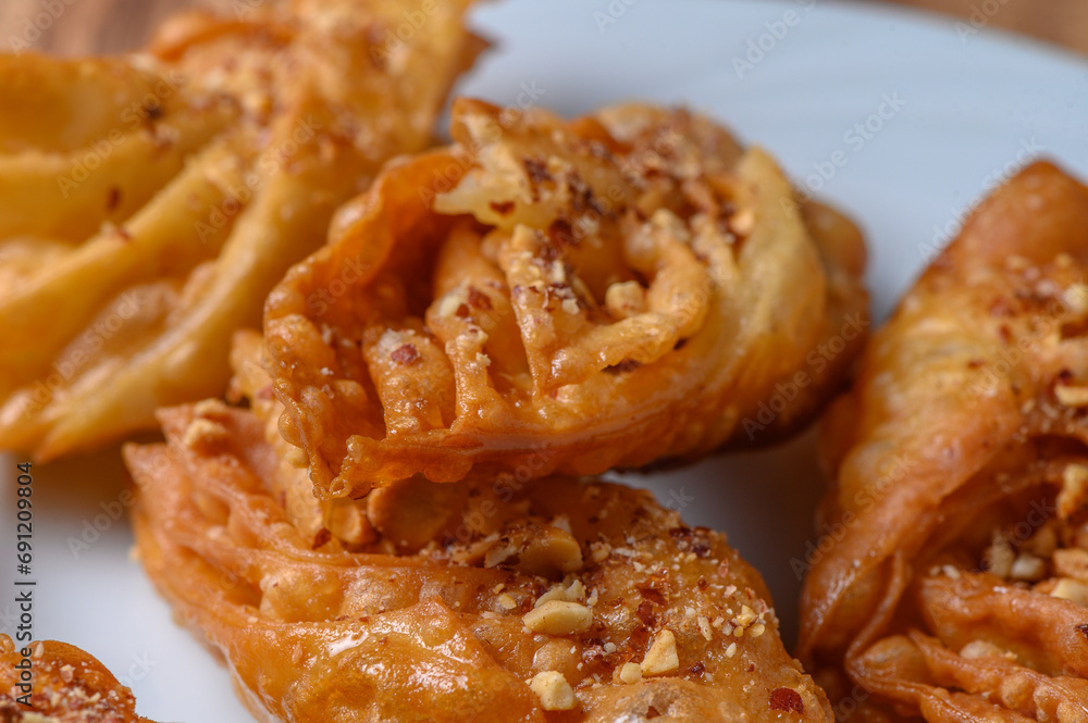 Turkish baklava, sweet dessert with honey on a light plate 9 Turkish baklava, sweet dessert with honey on a light plate 9