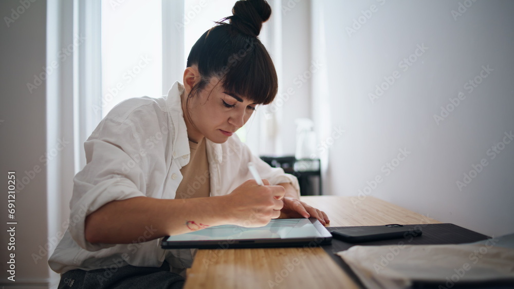 Tattoo artist drawing sketch at cozy place closeup. Woman using graphic tablet Tattoo artist drawing sketch at cozy place closeup. Woman using graphic tablet