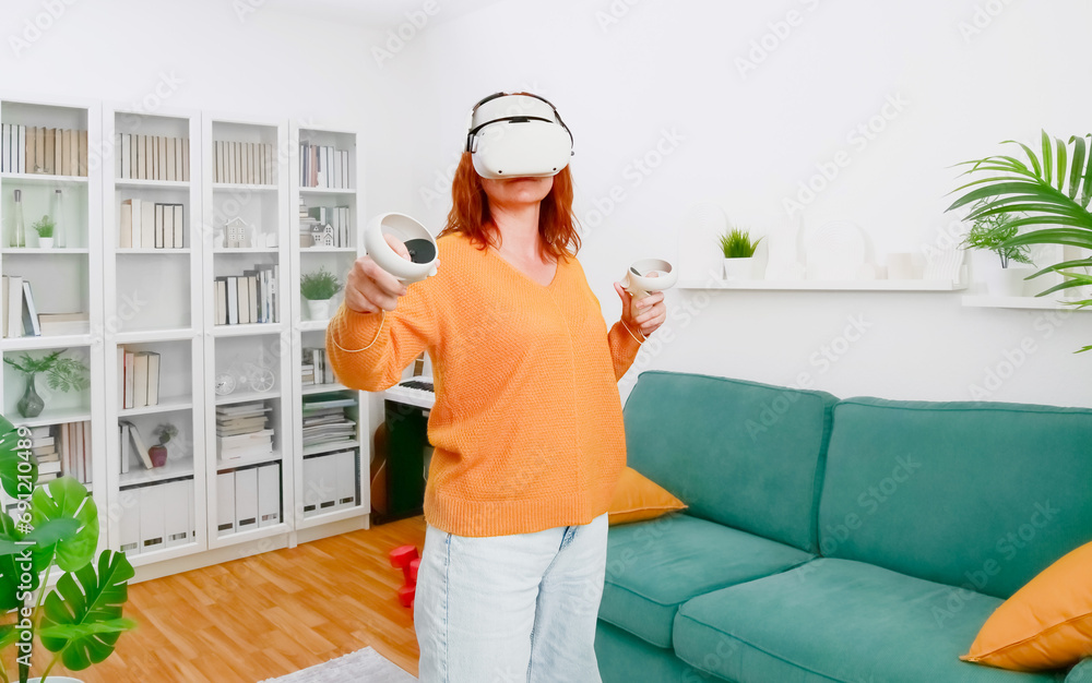 woman playing VR glasses. Sport in virtual reality. The concept of metaverse, virtual reality, future, technology and internet of things.