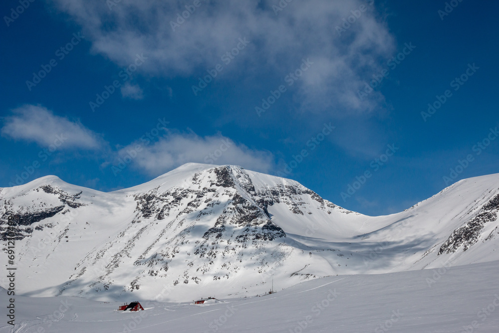 Tarfala research station covered with snow near Tarfala glacier, April, Lapland, Sweden