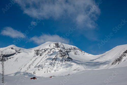 Tarfala research station covered with snow near Tarfala glacier, April, Lapland, Sweden