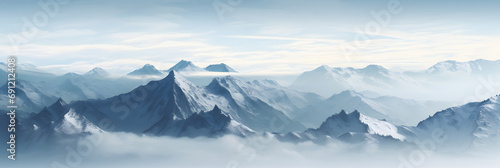 a panoramic view of snowy mountains with snow covered peaks covered with fog and snow in winters