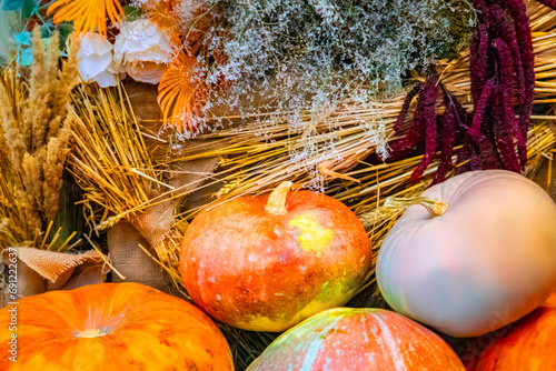 Thanksgiving and Autumn decoration concept made from autumn leaves and pumpkin on stone background