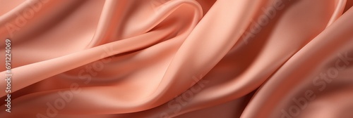 Peach-colored fabric with soft folds
