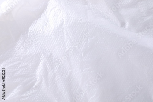 Texture of white plastic bag as background, closeup