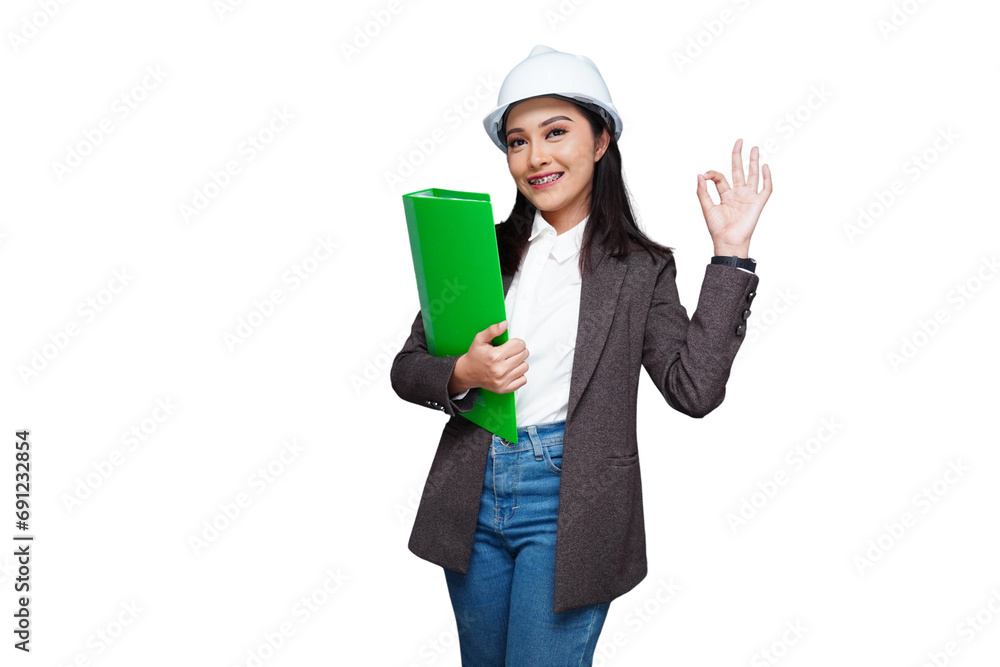 Young female worker wearing a helmet carrying a folder isolated transparent Young female worker wearing a helmet carrying a folder isolated transparent